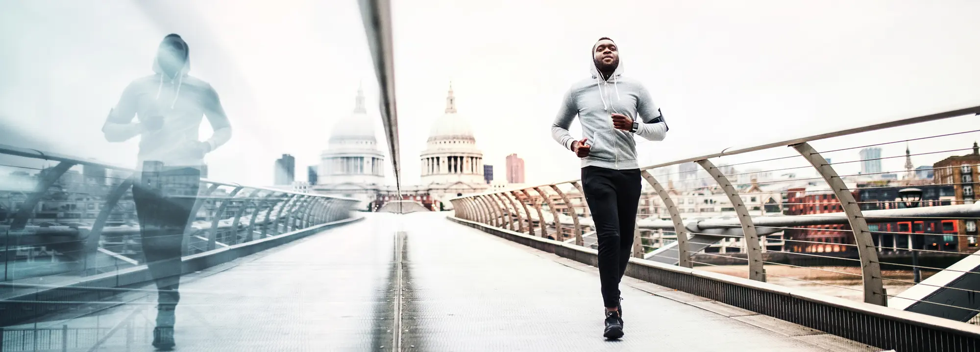 How far is too far - Lockdown rules for exercising outside - Man running ross a bridge in London