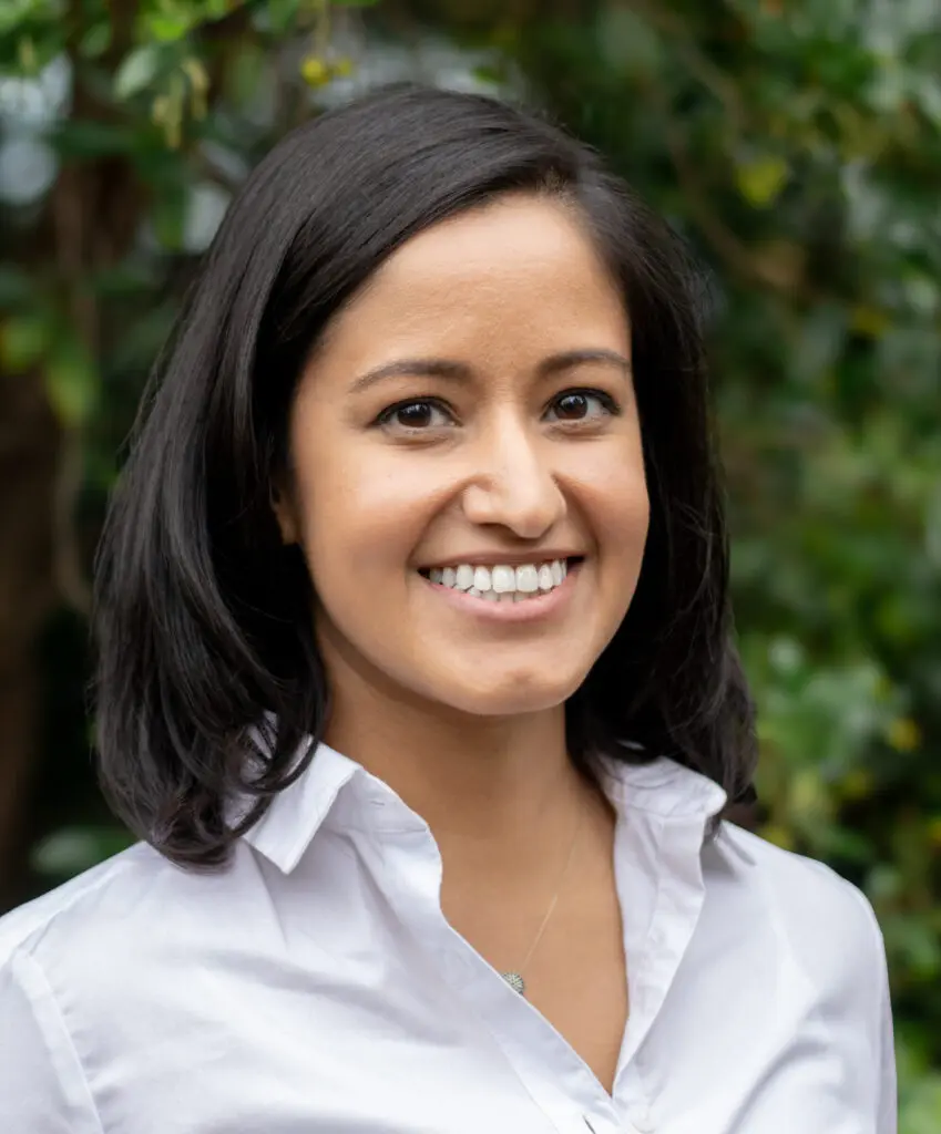 Portrait and team photograph of Dr Priya Anand at Freedom Clinics
