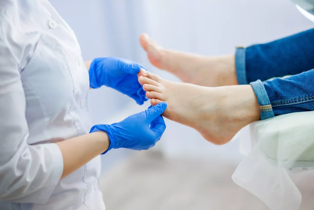 Foot health specialist assessing early joint deviation to help prevent hallux valgus and preserve toe alignment